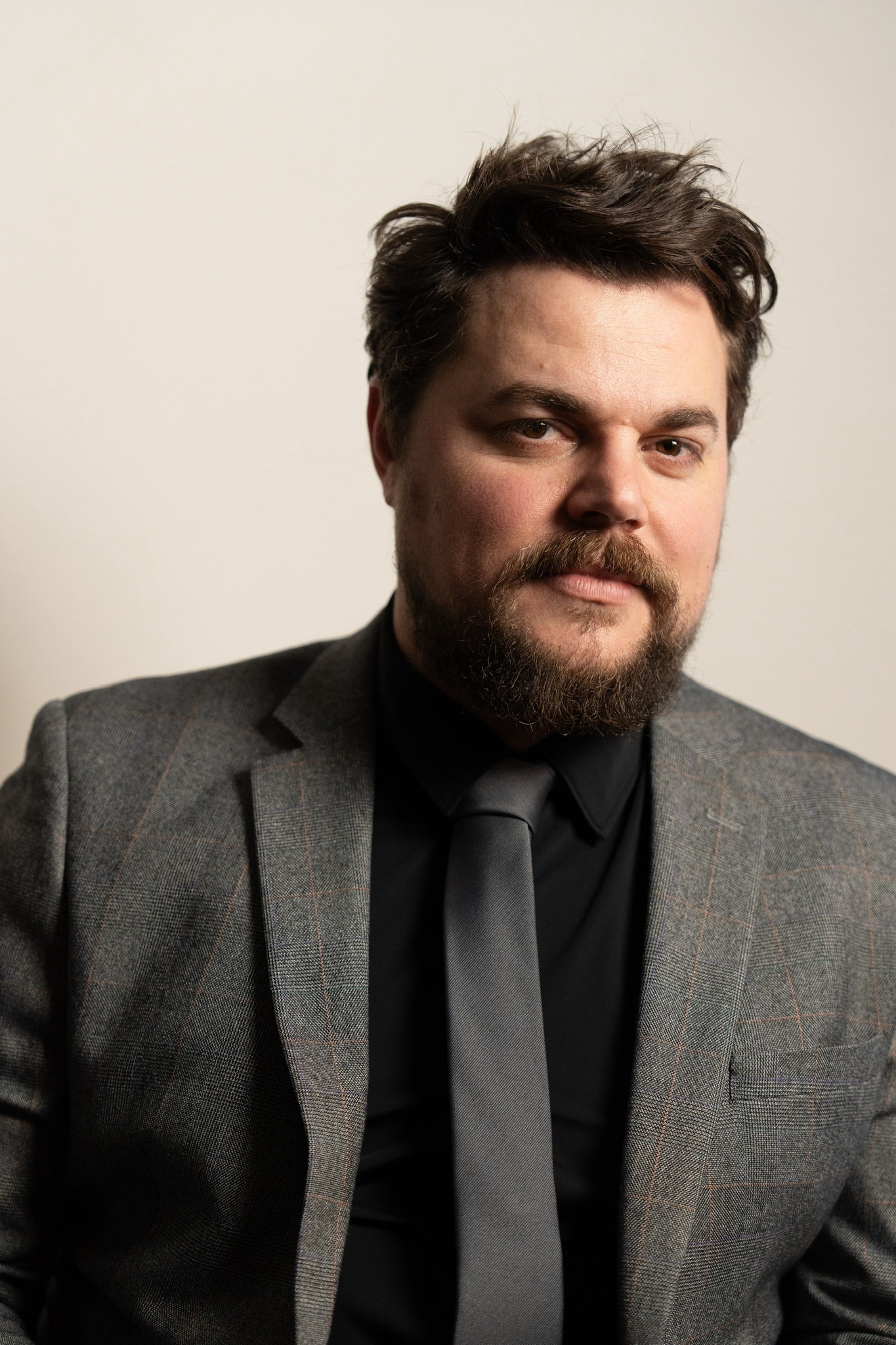 Portrait of a woman standing at a bar